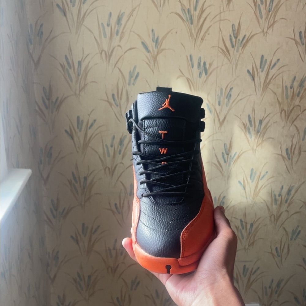 Jordan Men's Black and Orange High-Top Sneakers. read description